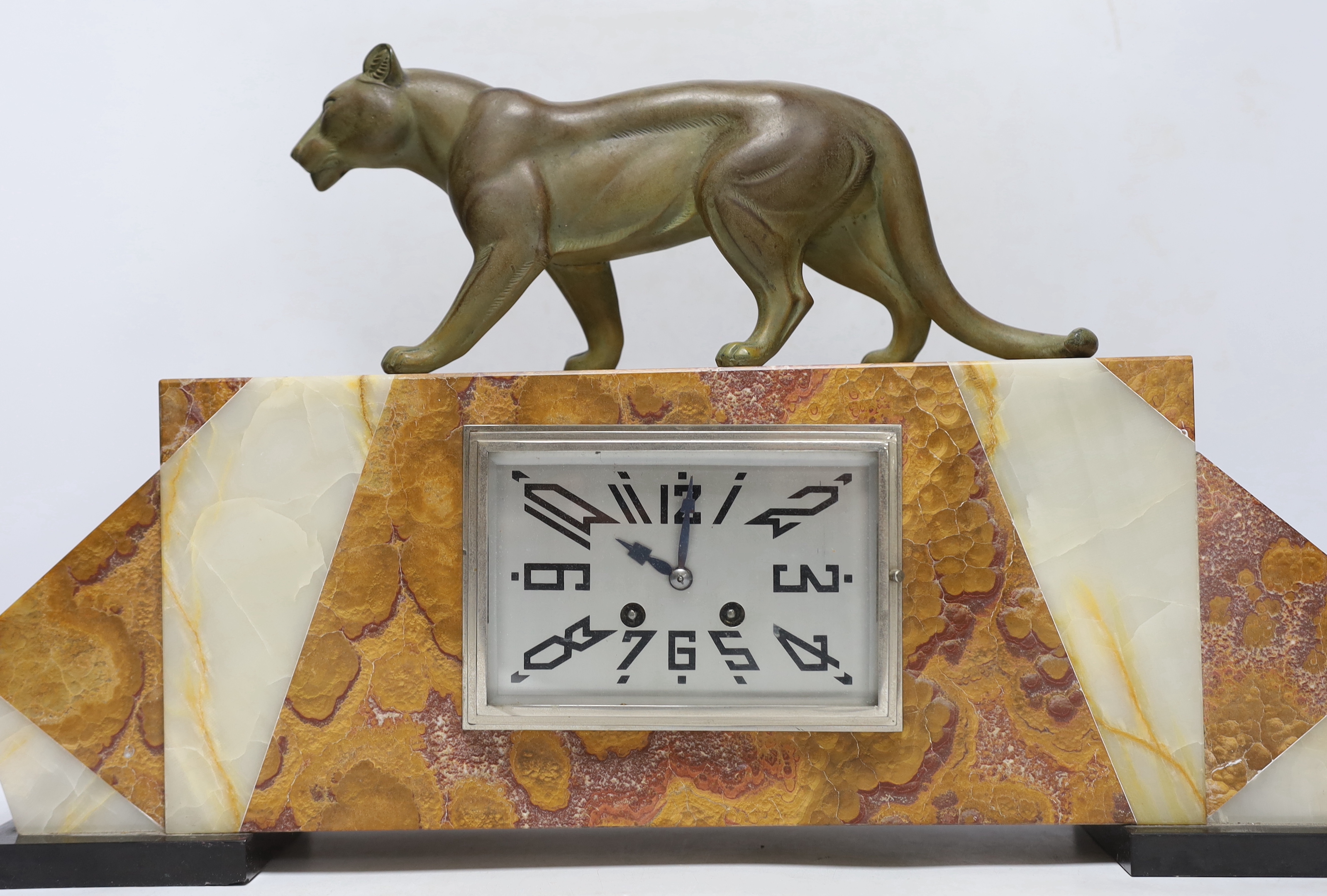 An Art Deco marble clock garniture, 1930’s with ‘panther’ mount